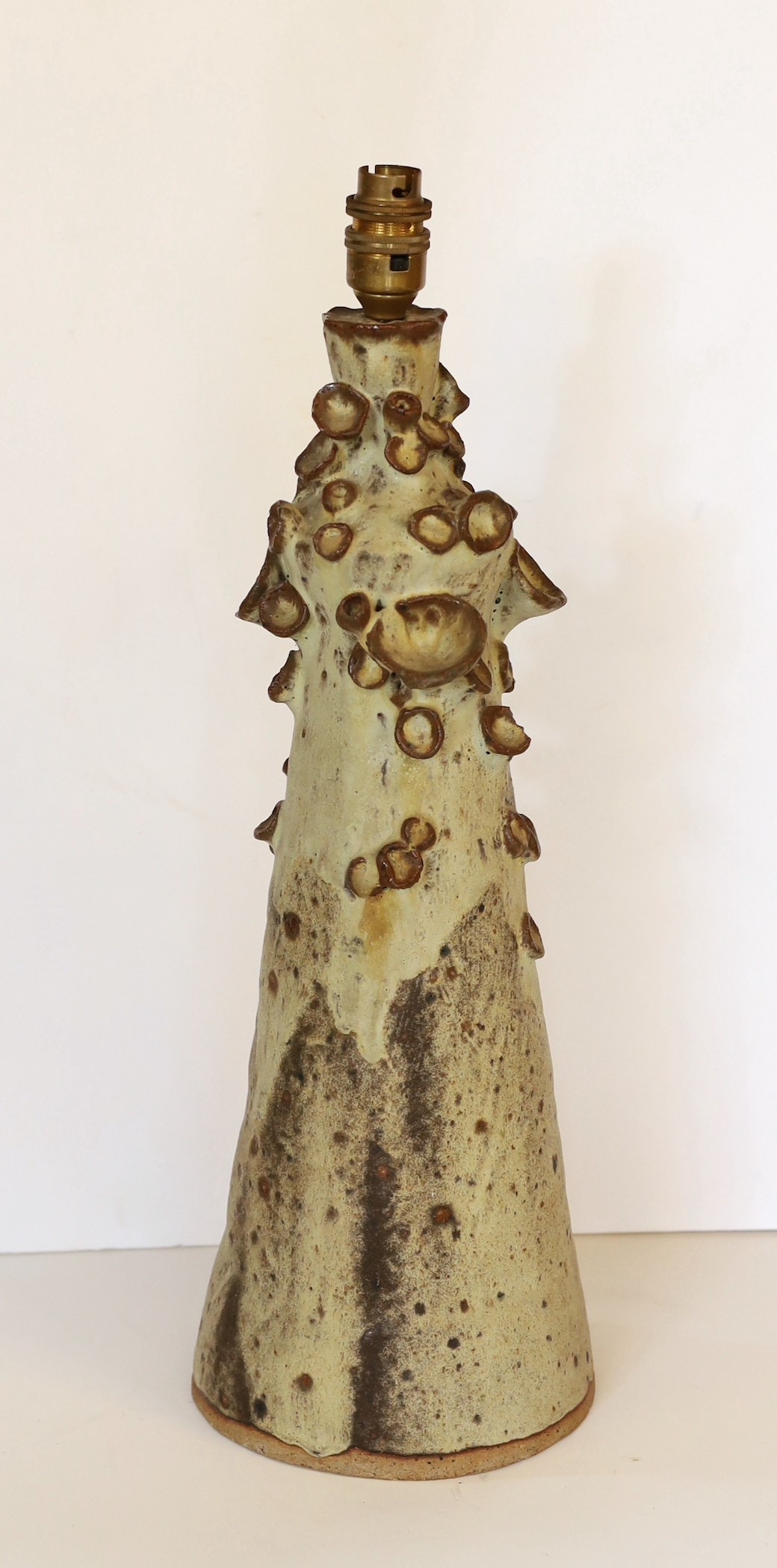 A 1970s German pottery table lamp of organic form, height 46cm